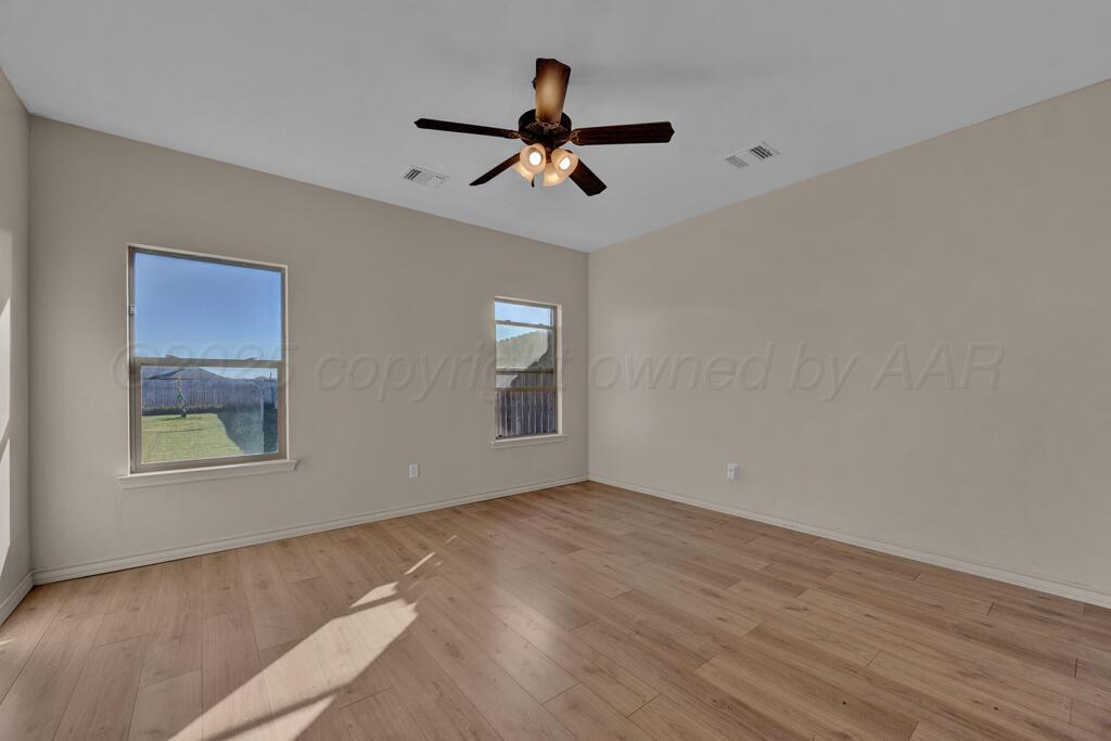 17801 Stone Creek Road Amarillo, TX 79124 - Photo 19 of 31 wooden floor in an empty room with a window