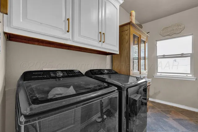 a kitchen with a stove and cabinets