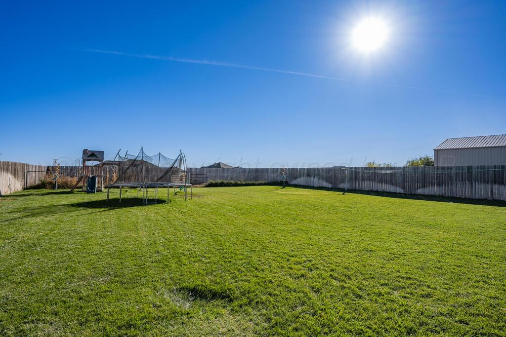 17801 Stone Creek Road Amarillo, TX 79124 - Photo 31 of 31 a view of a swimming pool and an outdoor seating