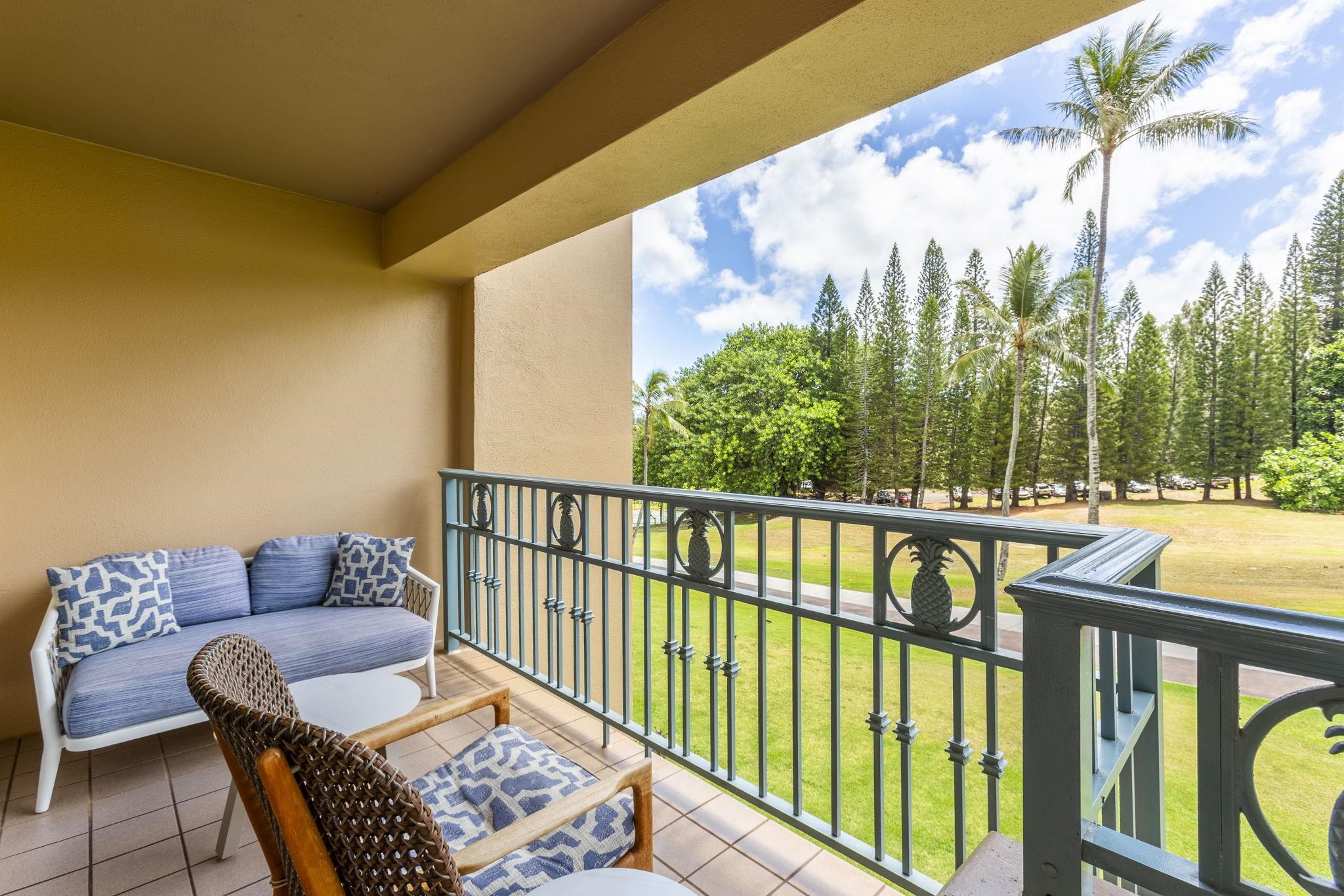 1 Ritz Carlton Drive, Unit 122123 Lahaina, HI 96761 - Photo 11 of 50 a balcony with wooden floor and outdoor seating