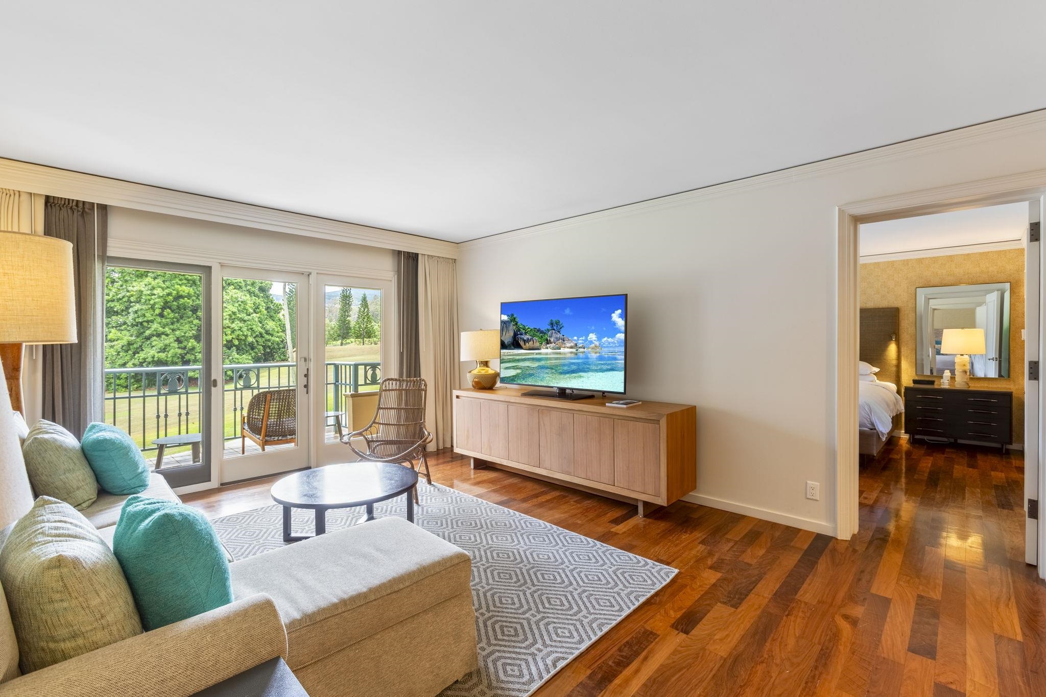 1 Ritz Carlton Drive, Unit 122123 Lahaina, HI 96761 - Photo 13 of 50 a living room with furniture and a flat screen tv