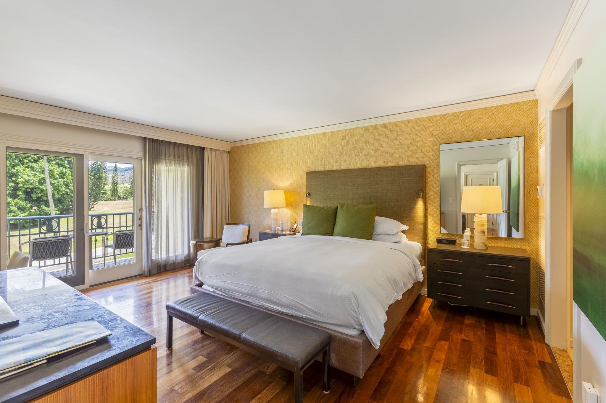 1 Ritz Carlton Drive, Unit 122123 Lahaina, HI 96761 - Photo 14 of 50 a bedroom with a bed and wooden floor