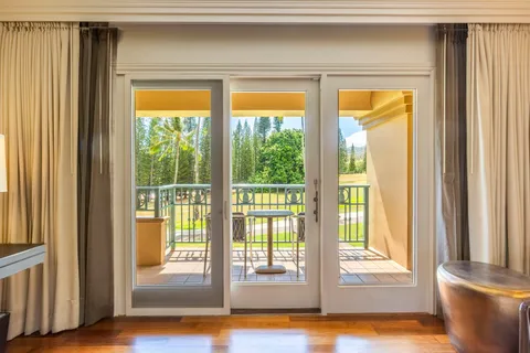a view of front door and wooden floor
