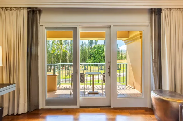 a view of front door and wooden floor