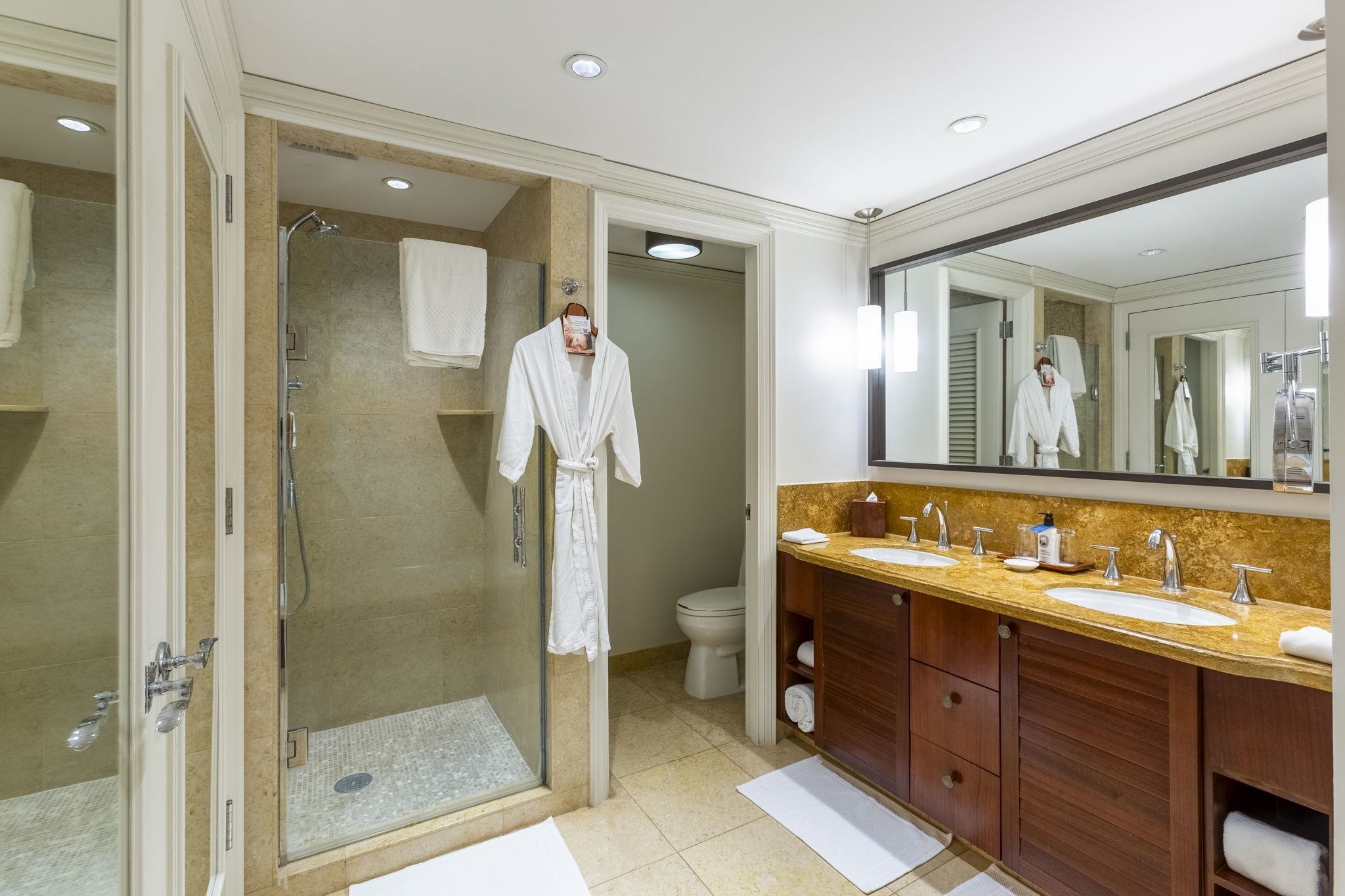 1 Ritz Carlton Drive, Unit 122123 Lahaina, HI 96761 - Photo 21 of 50 a spacious bathroom with a shower sink and mirror