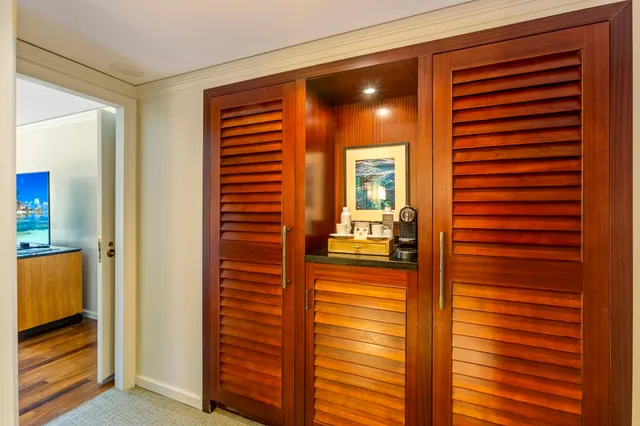 a bedroom with two beds and a large window