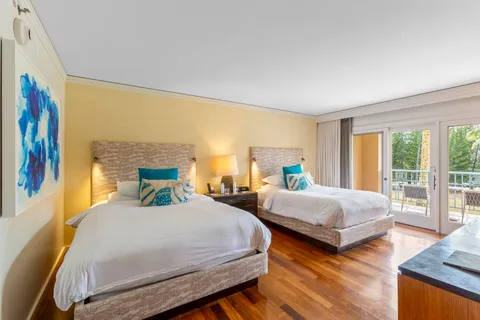 a bedroom with a bed and a desk