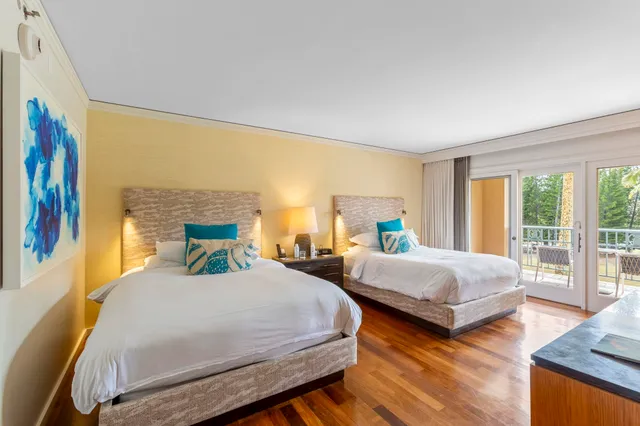 a bedroom with a bed and a desk