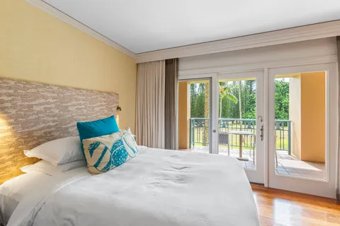 a view of a chairs and table in patio