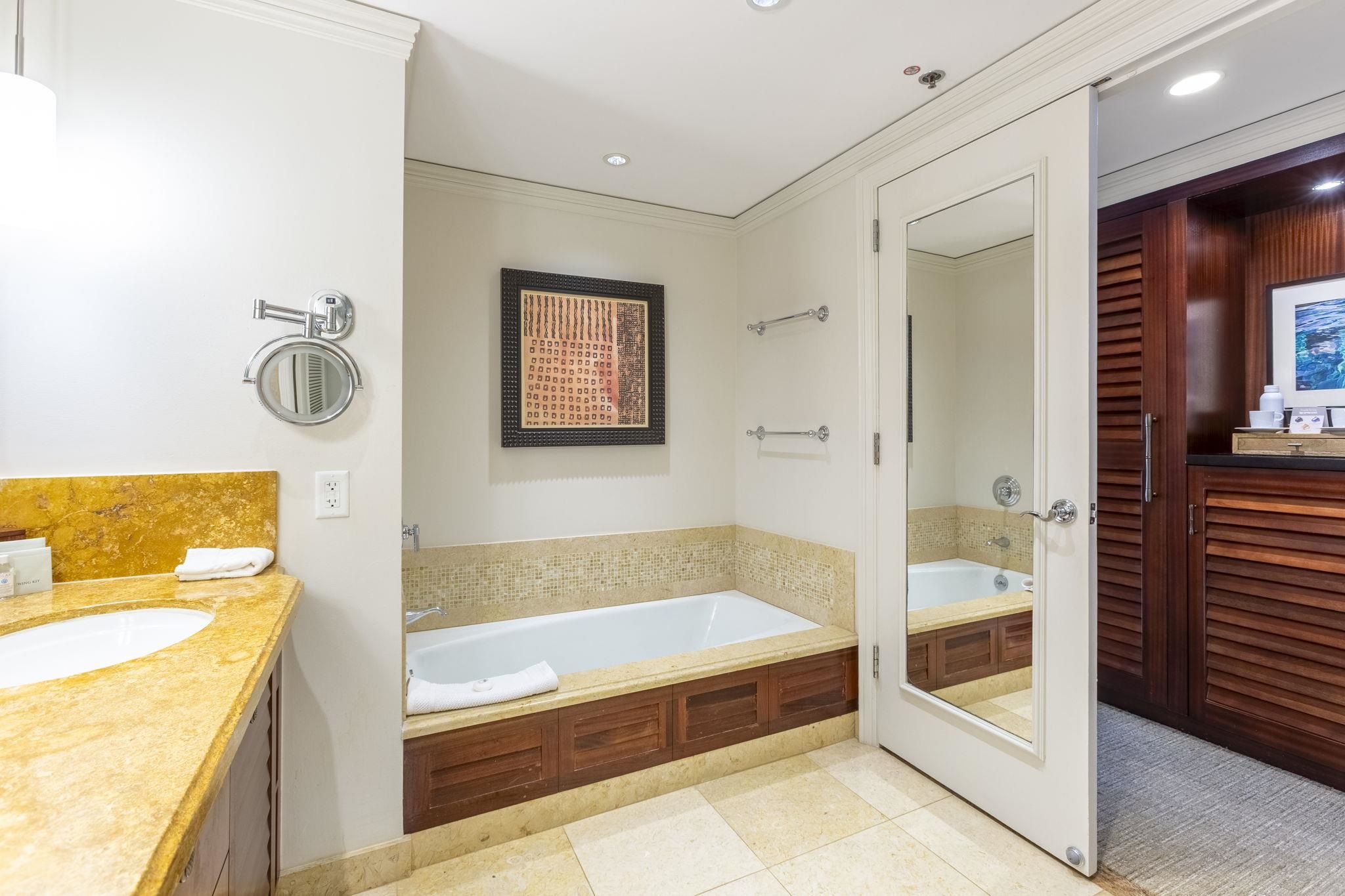 1 Ritz Carlton Drive, Unit 122123 Lahaina, HI 96761 - Photo 28 of 50 a bathroom with a tub and a shower