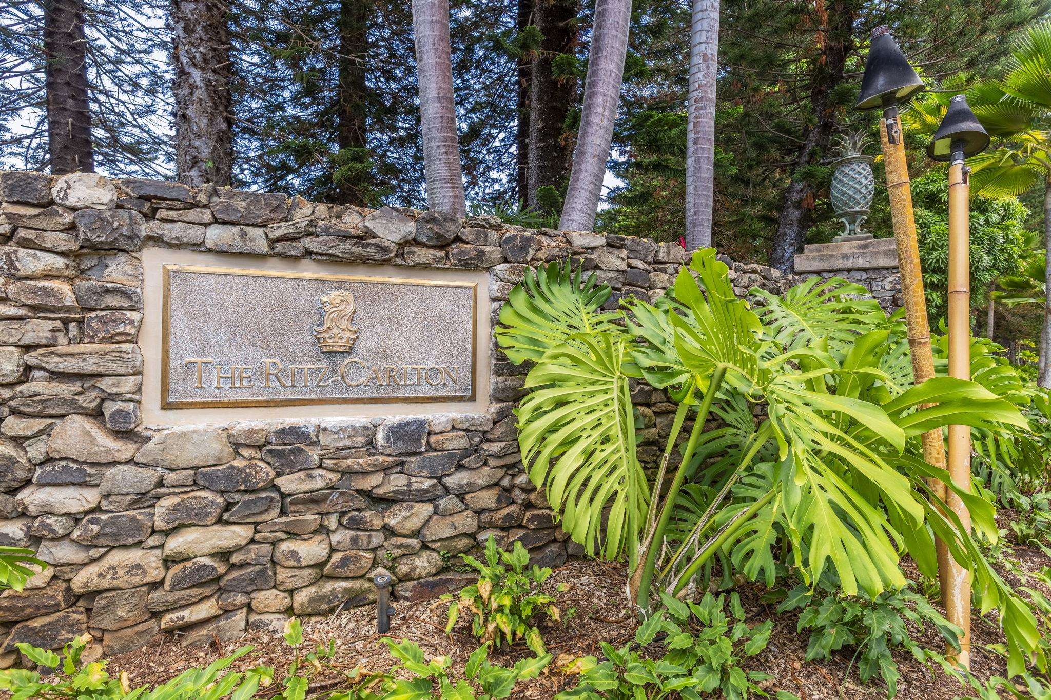 1 Ritz Carlton Drive, Unit 122123 Lahaina, HI 96761 - Photo 30 of 50 a sign that is sitting in front of a brick house