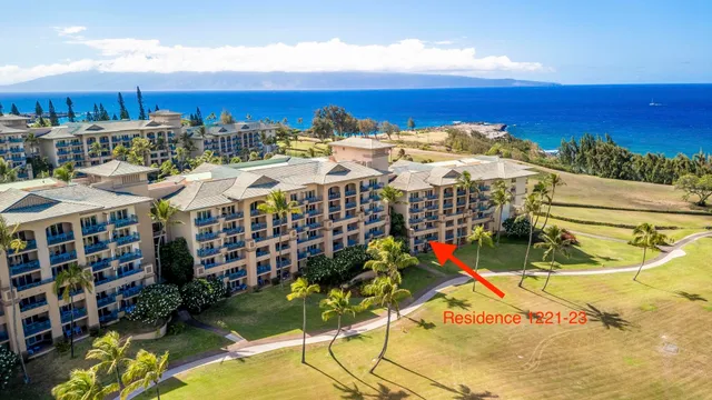 a view of a balcony with a table and chairs