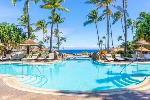 a view of swimming pool with outdoor seating