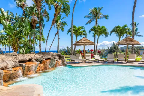 a view of swimming pool with outdoor seating and yard