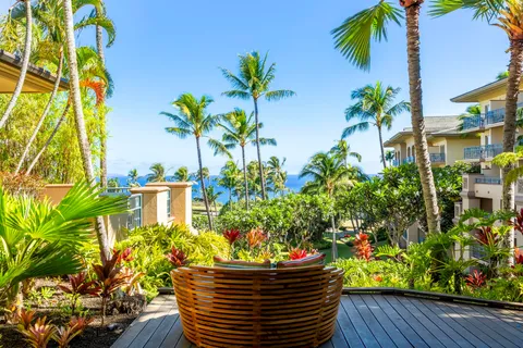 a view of swimming pool with outdoor seating and plants