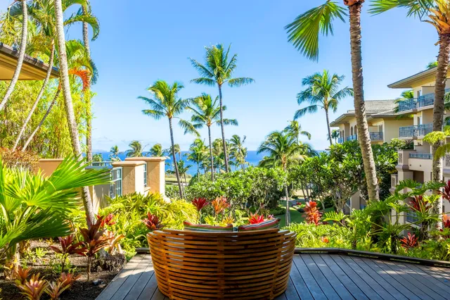 a view of swimming pool with outdoor seating and plants