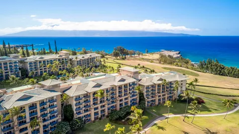 a view of a garden with a building in the background