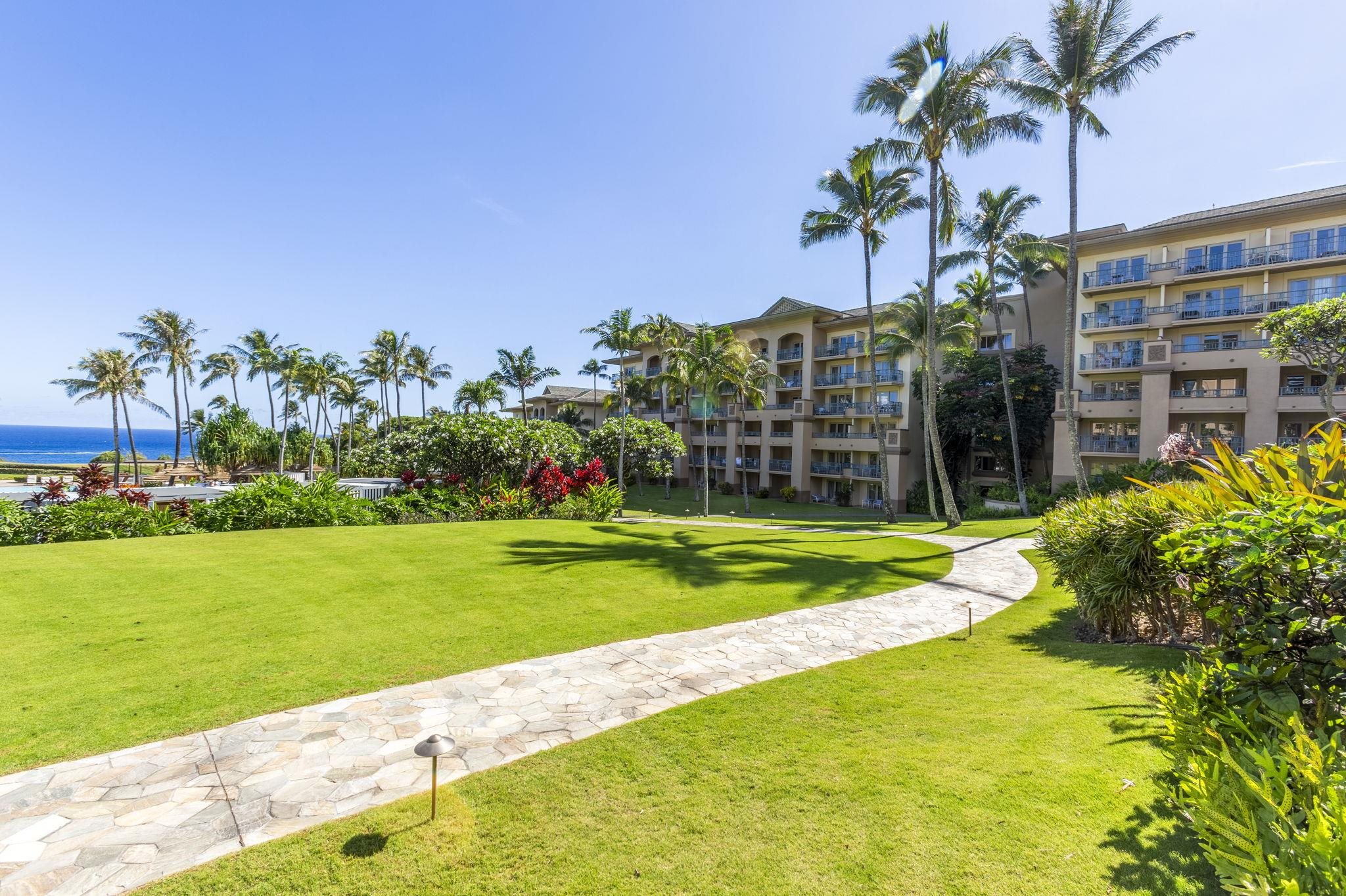 1 Ritz Carlton Drive, Unit 122123 Lahaina, HI 96761 - Photo 45 of 50 a view of a garden with a building in the background