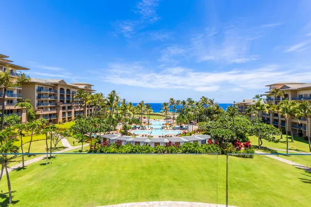 a view of a town with mountains in the background