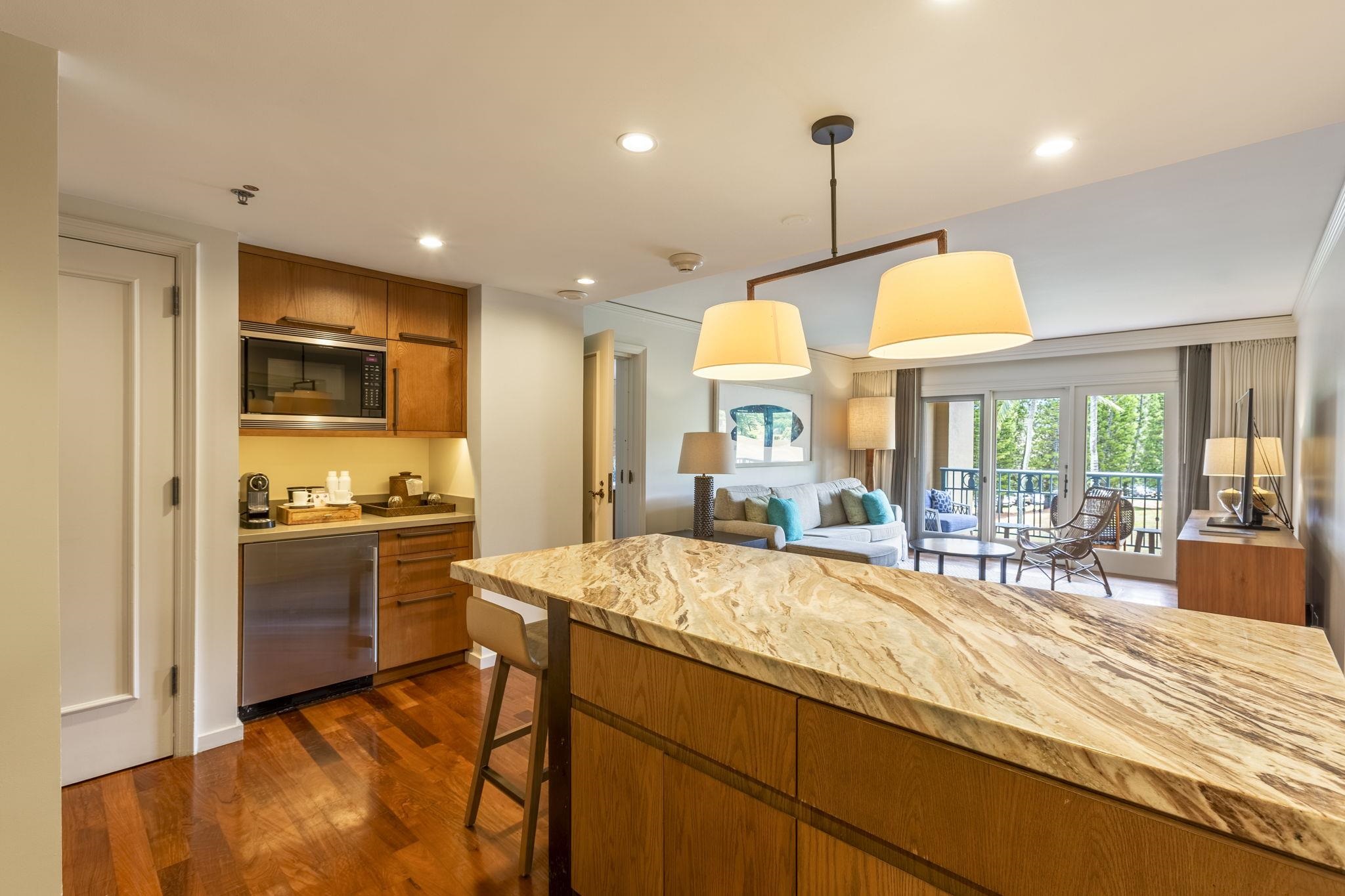 1 Ritz Carlton Drive, Unit 122123 Lahaina, HI 96761 - Photo 7 of 50 a kitchen with stainless steel appliances granite countertop a sink stove and refrigerator