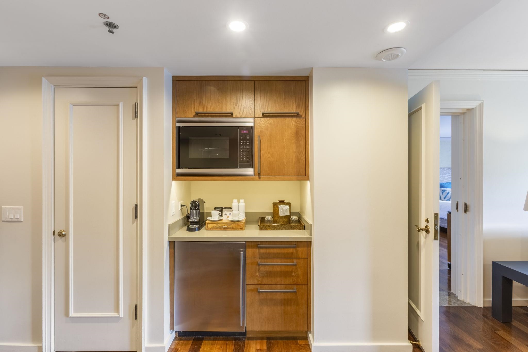 1 Ritz Carlton Drive, Unit 122123 Lahaina, HI 96761 - Photo 9 of 50 a bathroom with a sink a light fixture and a mirror