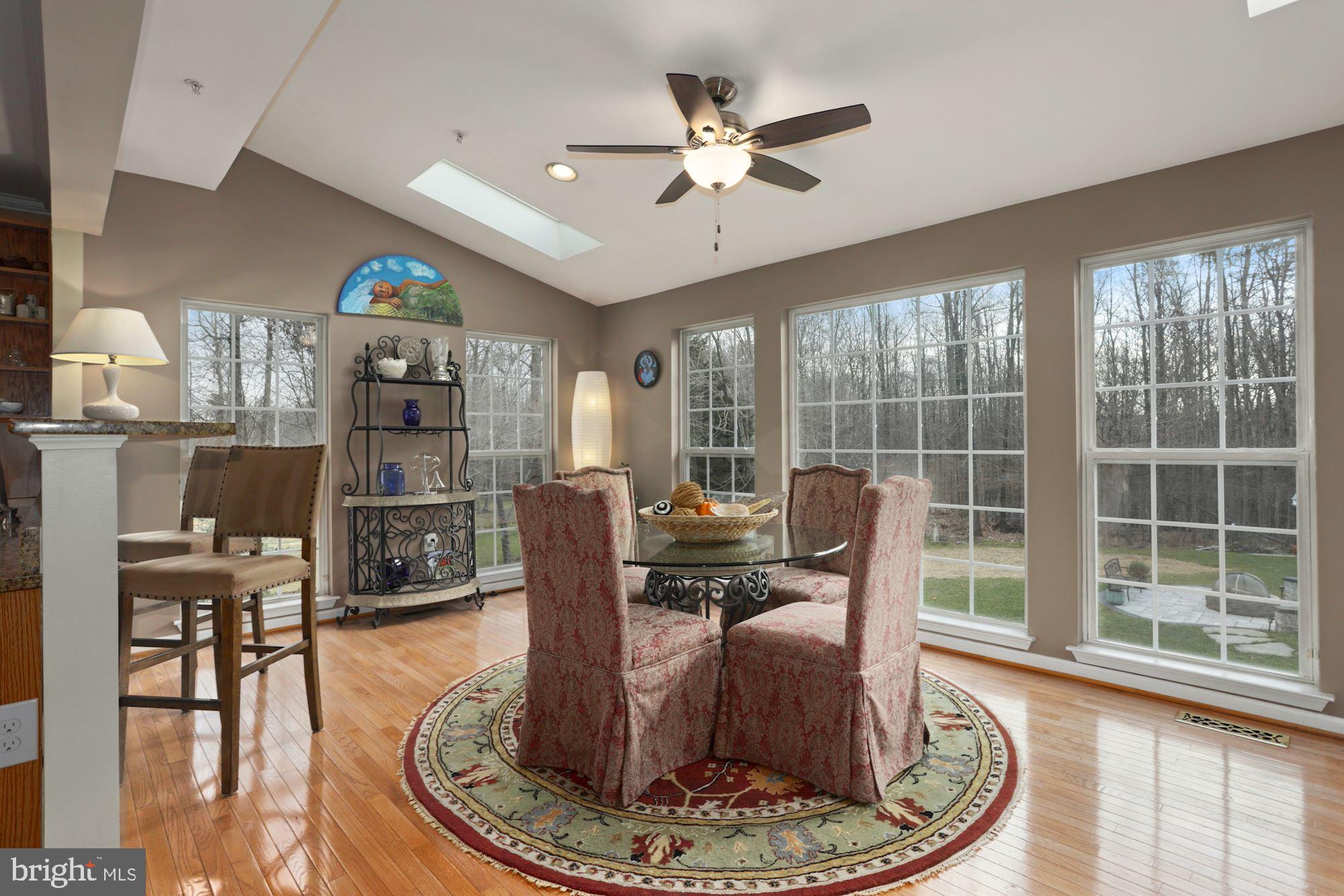 9411 Merkel Road Bowie, MD 20715 - Photo 11 of 42 Table Space Kitchen with Skylight and sylvan view