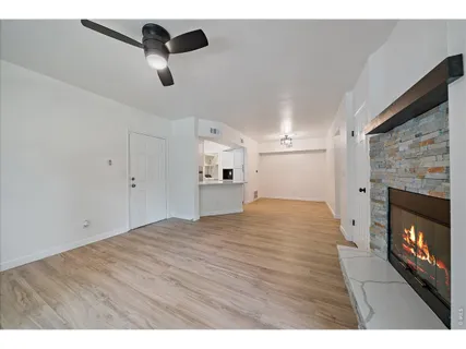 a view of empty room with a fireplace