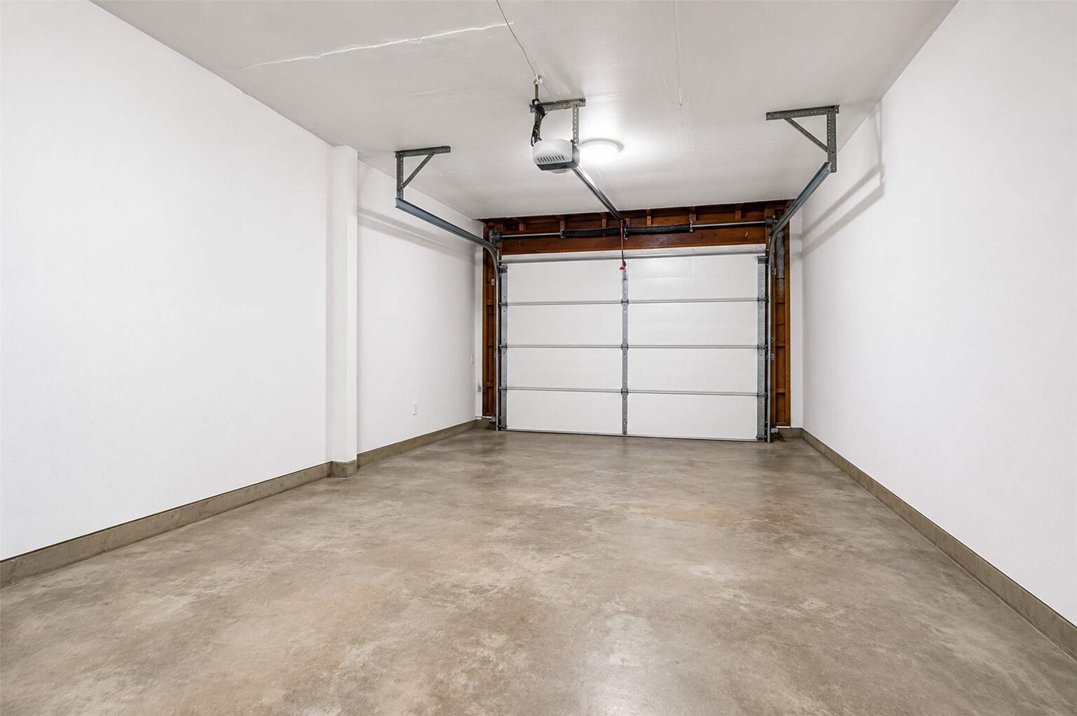 1306 Camden Road Pasadena, TX 77502 - Photo 16 of 16 Clean and spacious attached garage with automatic opener, freshly painted walls, and plenty of room for your vehicle and extra storage!