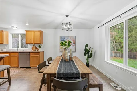 a view of a dining room with furniture window and outside view