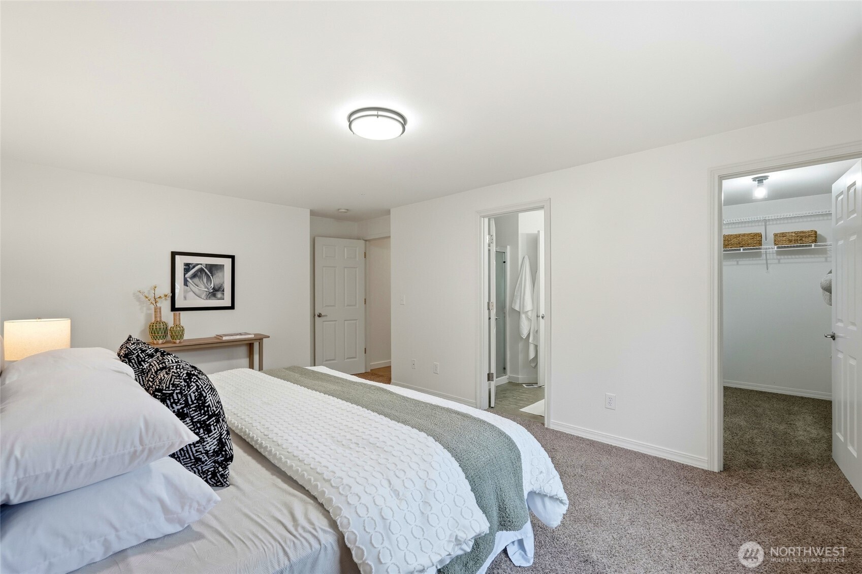 18219 58th St Court East Lake Tapps, WA 98391 - Photo 20 of 40 a bedroom with a bed and a view of bathroom