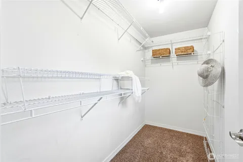 a view of storage and utility room with washer and dryer