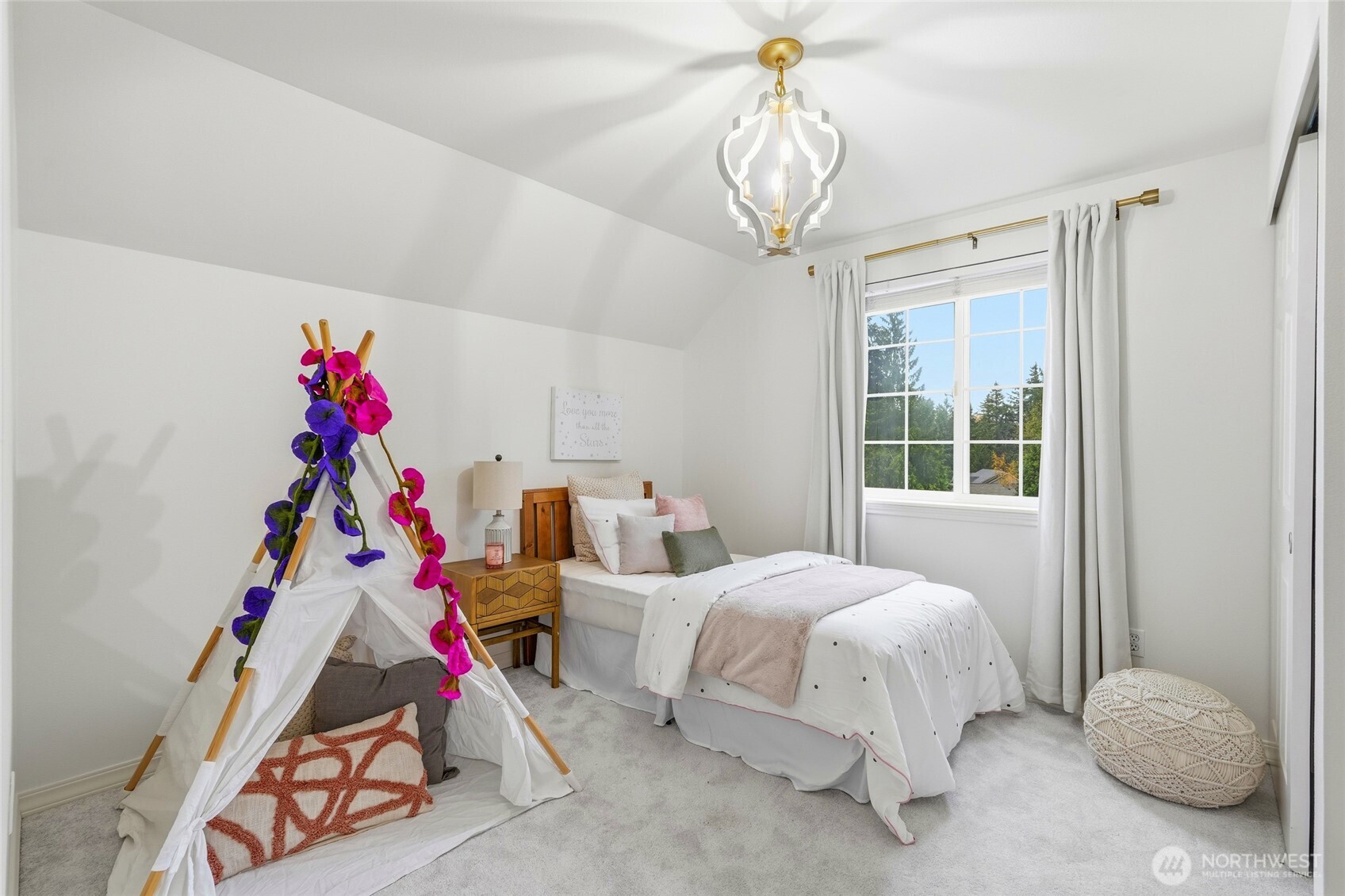 18219 58th St Court East Lake Tapps, WA 98391 - Photo 24 of 40 a bedroom with furniture and a chandelier