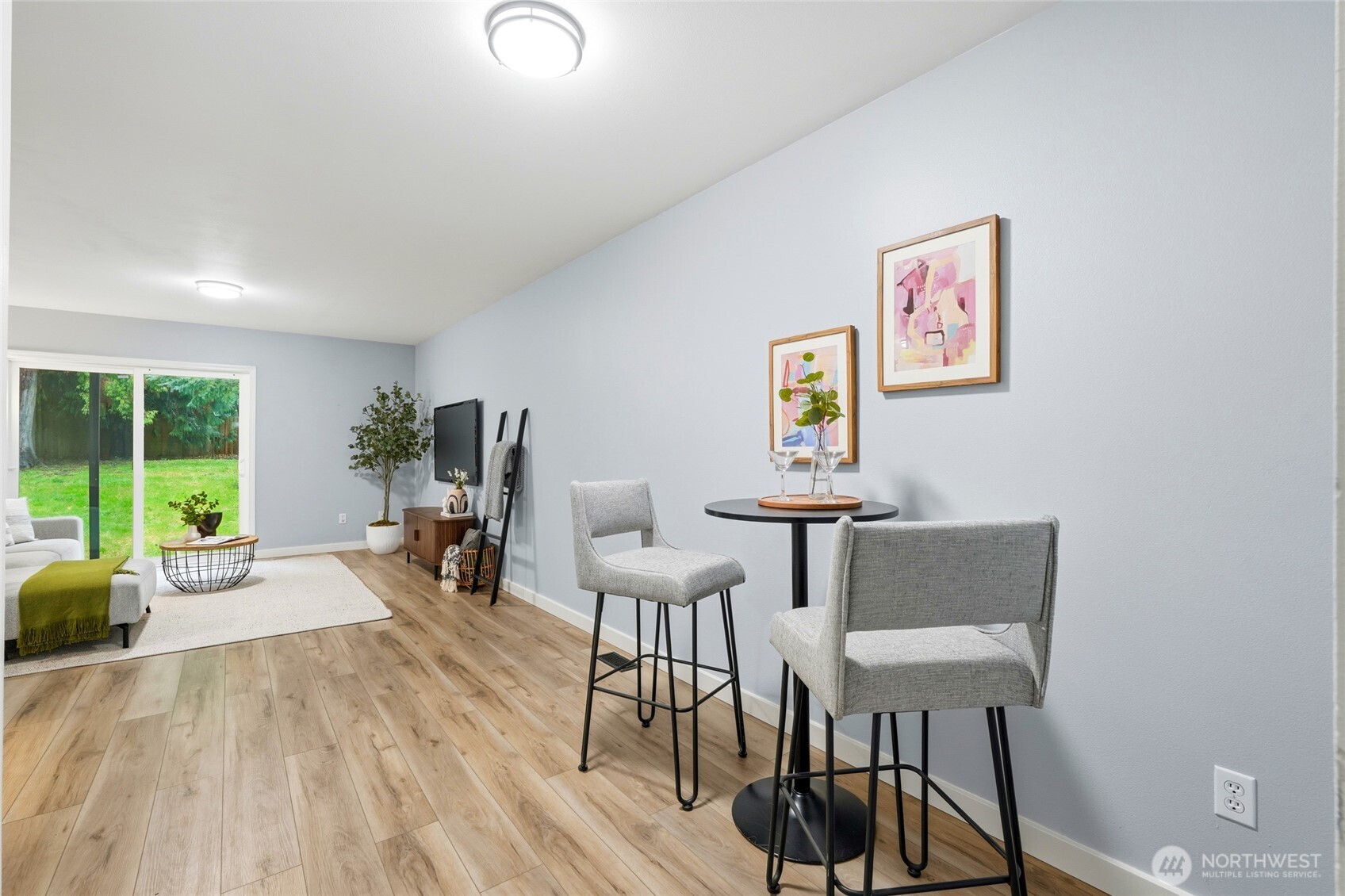 18219 58th St Court East Lake Tapps, WA 98391 - Photo 26 of 40 a living room with furniture a table and a large window