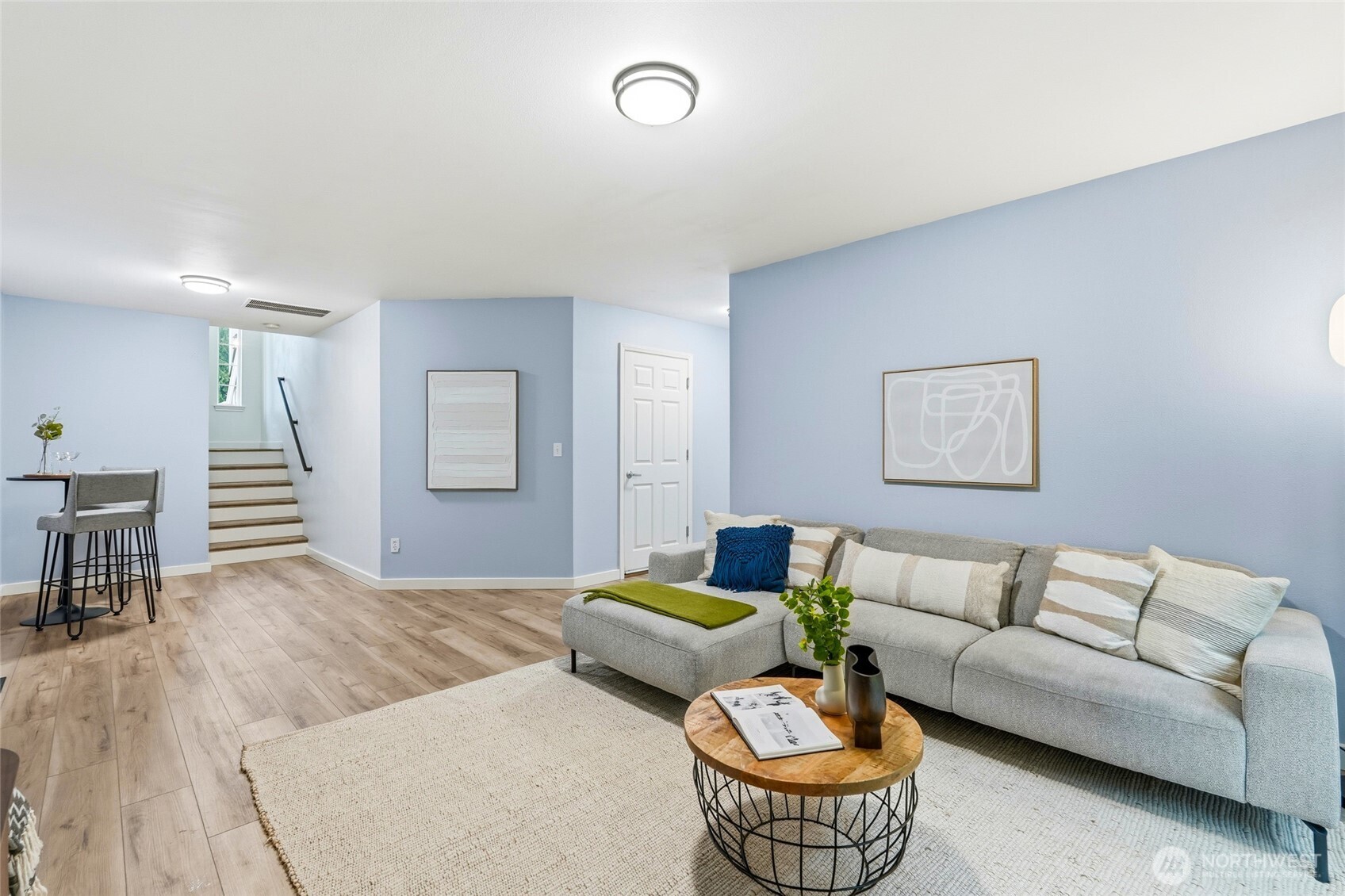 18219 58th St Court East Lake Tapps, WA 98391 - Photo 29 of 40 a living room with furniture and a dining table