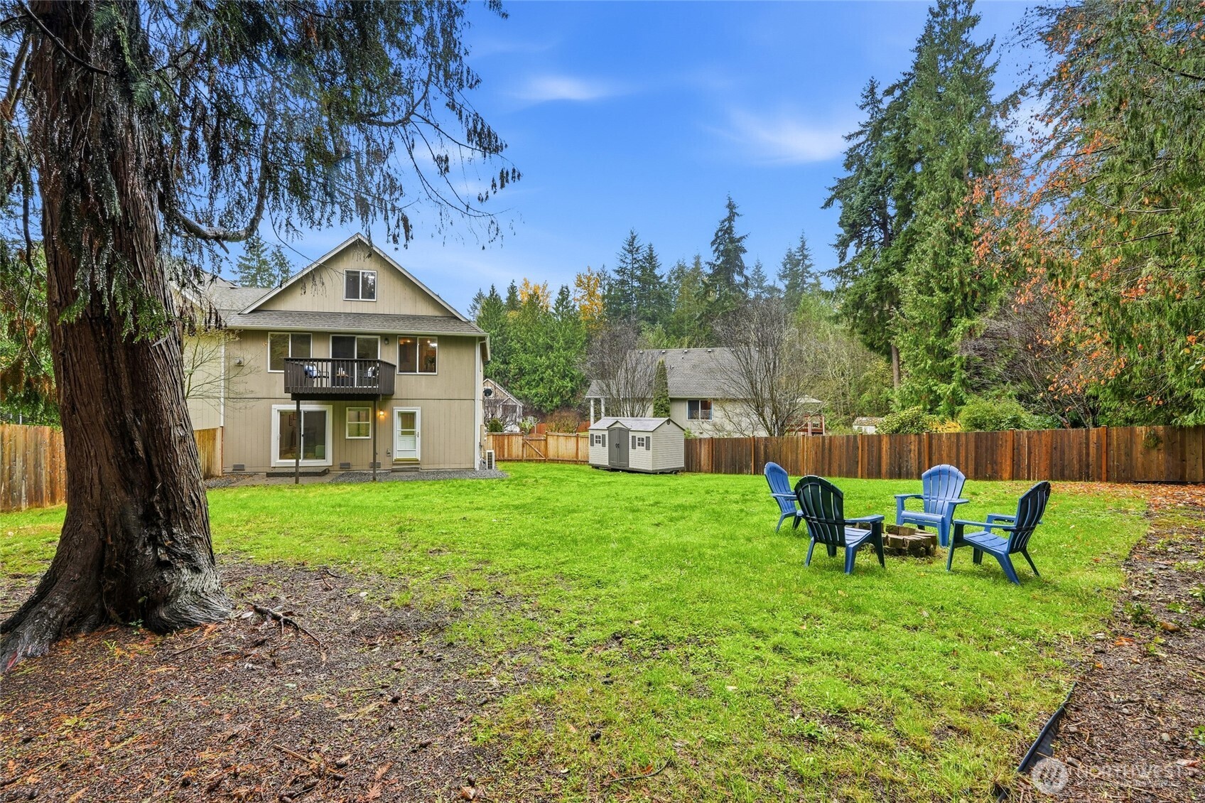 18219 58th St Court East Lake Tapps, WA 98391 - Photo 35 of 40 a view of a chair and table in the garden