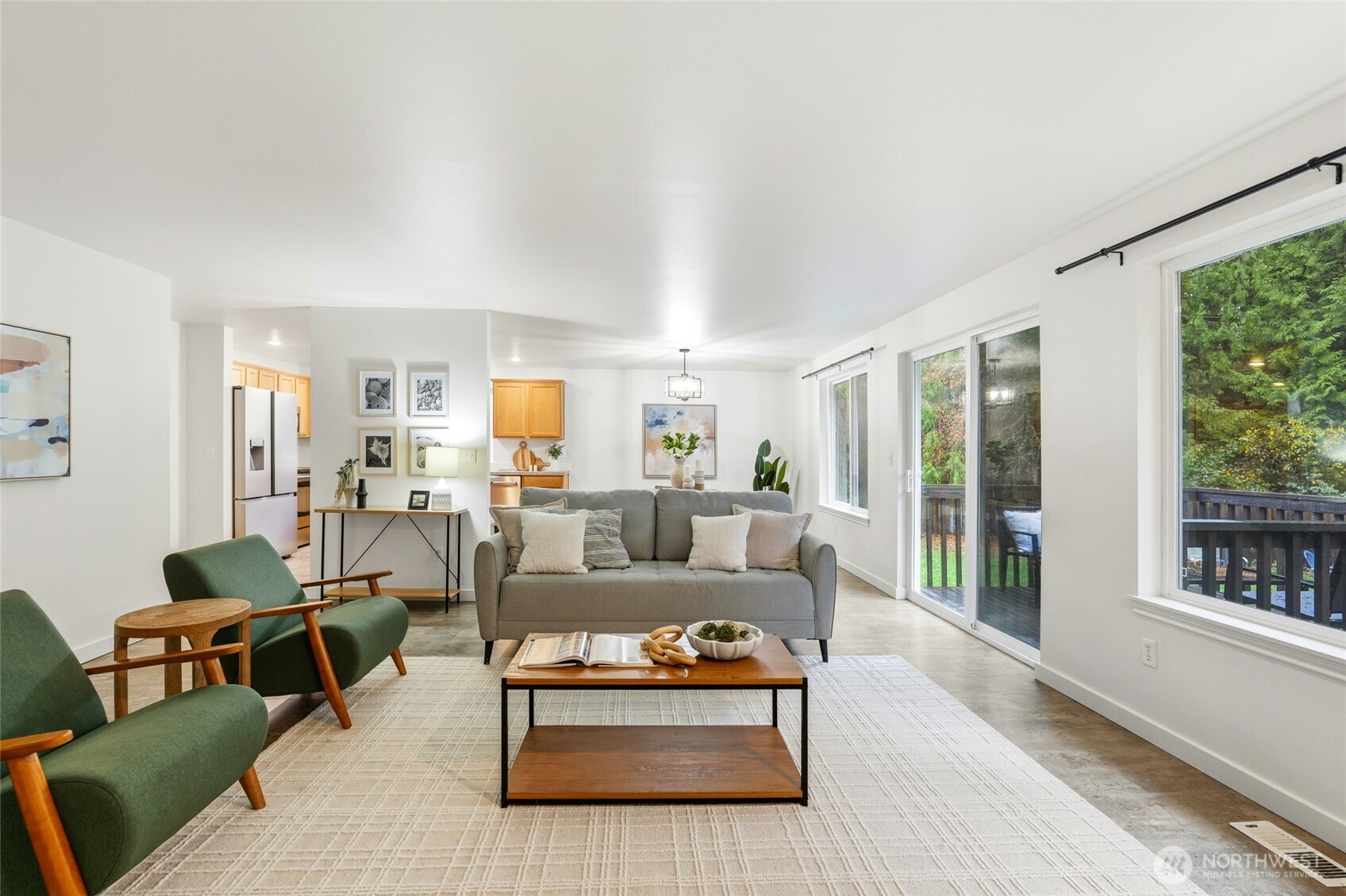 18219 58th St Court East Lake Tapps, WA 98391 - Photo 7 of 40 a living room with furniture and a large window