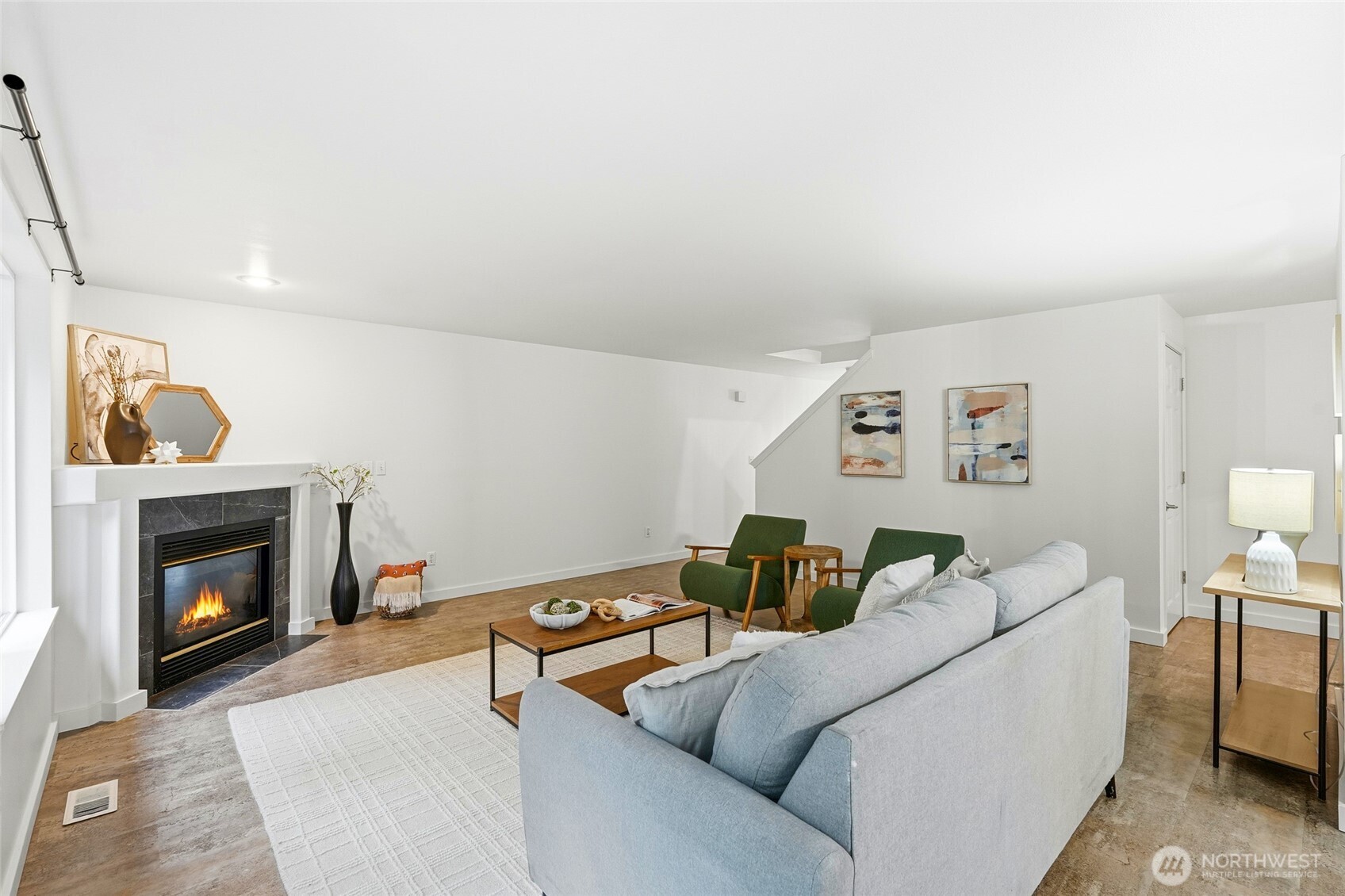 18219 58th St Court East Lake Tapps, WA 98391 - Photo 9 of 40 a living room with furniture and a fireplace