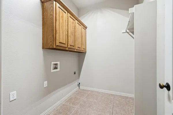 a dining room with furniture and a floor to ceiling window