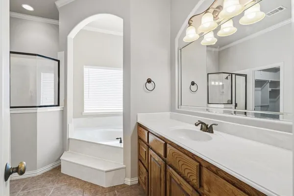 a spacious bathroom with a double vanity sink mirror and