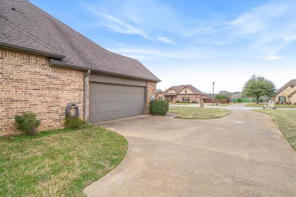 a view of a lake with houses in the back