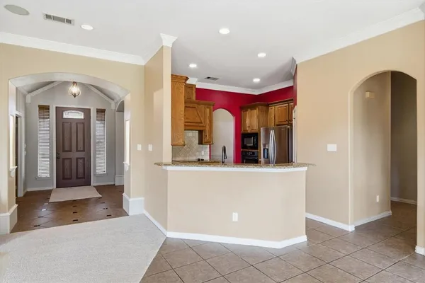 a living room with fireplace furniture and a flat screen tv