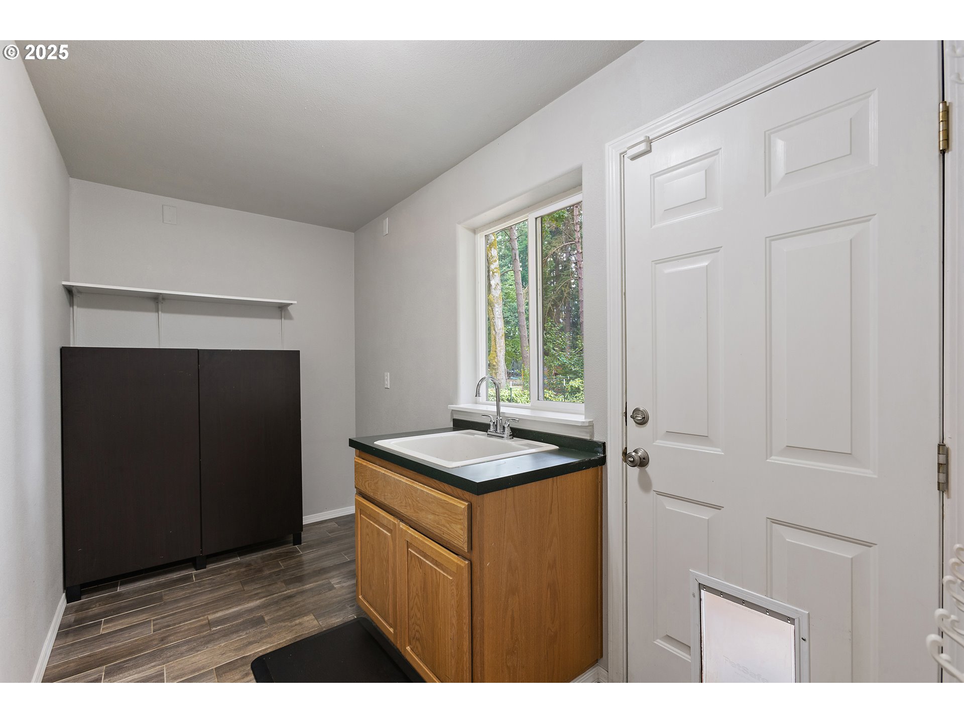 7771 St Charles Street Northeast Keizer, OR 97303 - Photo 13 of 42 a kitchen with a sink and cabinets