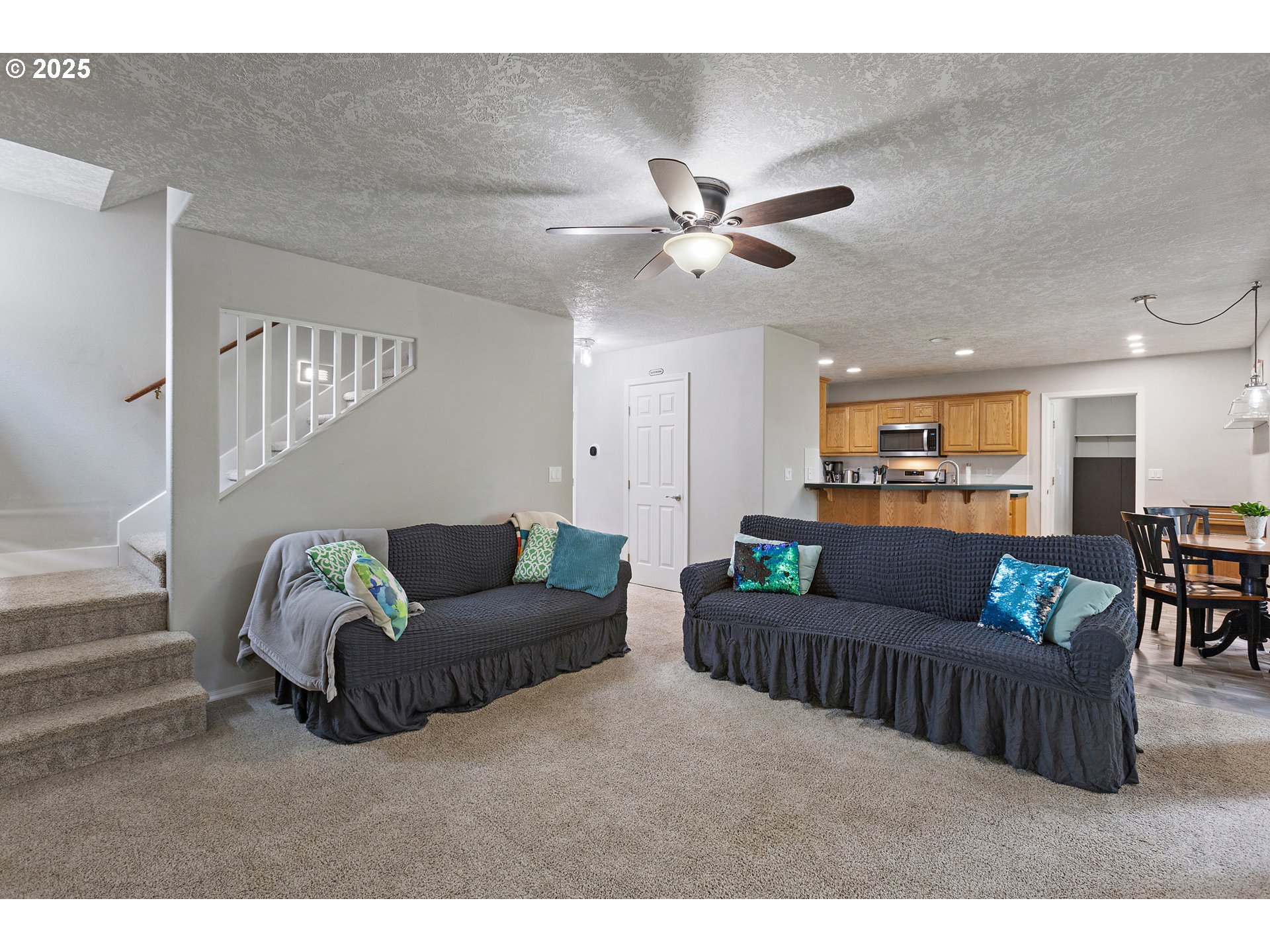 7771 St Charles Street Northeast Keizer, OR 97303 - Photo 17 of 42 a living room with furniture and a ceiling fan