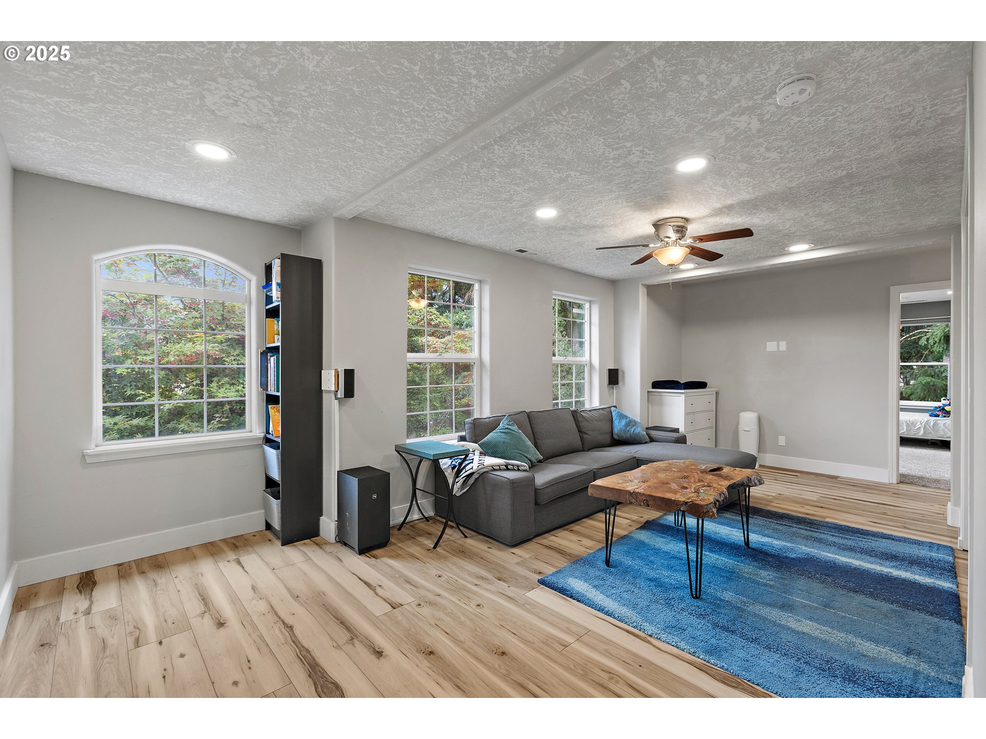 7771 St Charles Street Northeast Keizer, OR 97303 - Photo 18 of 42 a living room with furniture and a wooden floor