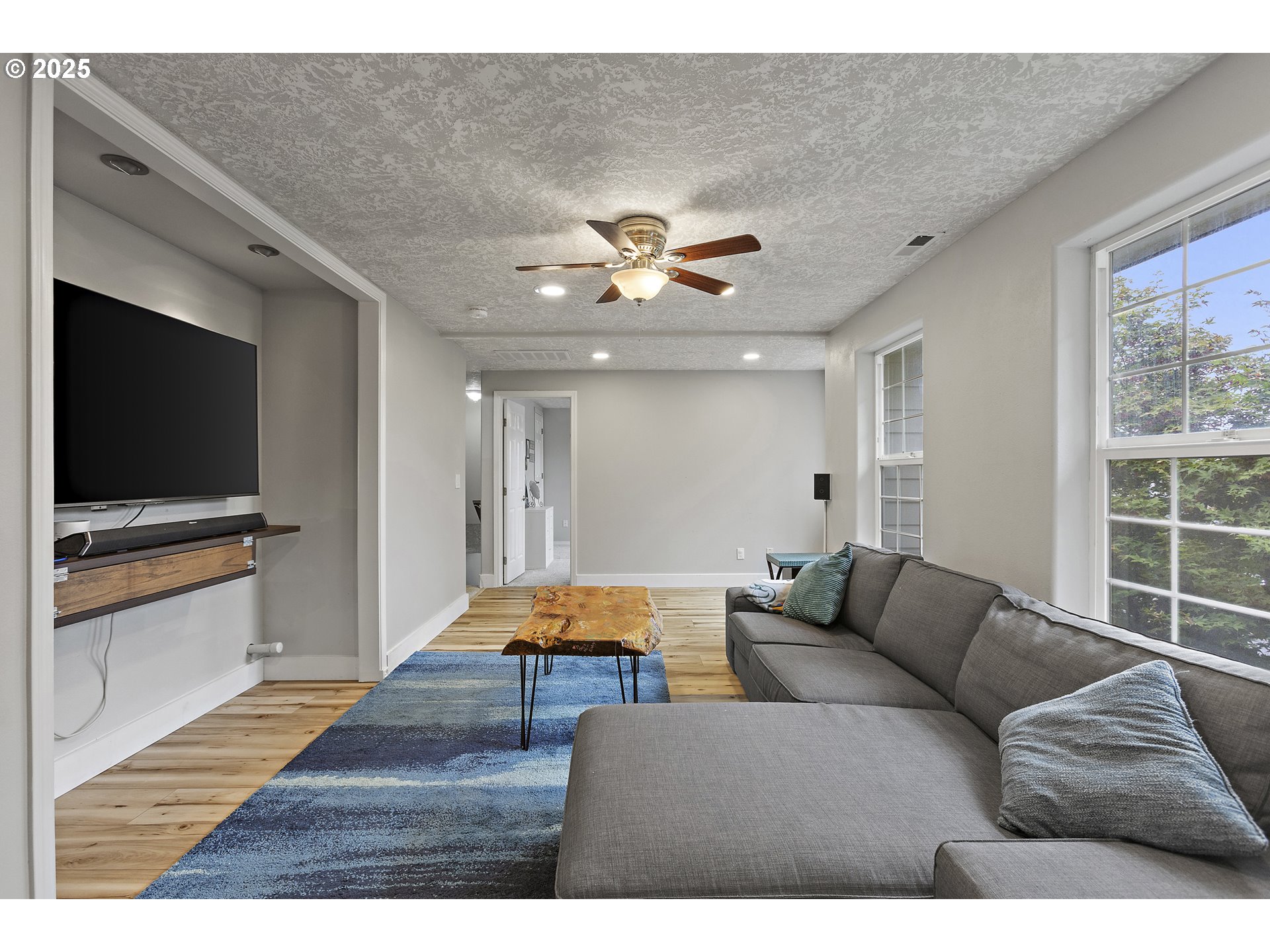 7771 St Charles Street Northeast Keizer, OR 97303 - Photo 19 of 42 a living room with furniture and a flat screen tv