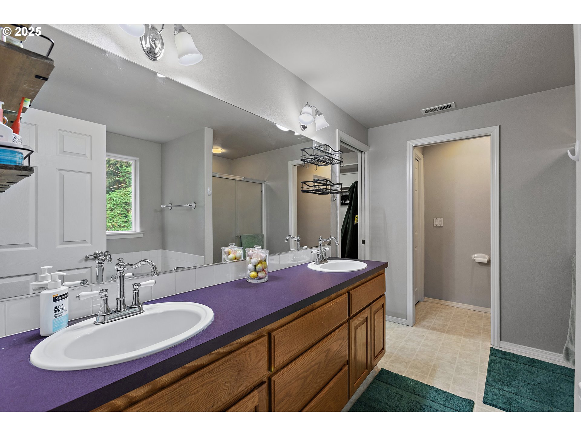 7771 St Charles Street Northeast Keizer, OR 97303 - Photo 26 of 42 a bathroom with a sink double vanity granite tub shower and a mirror