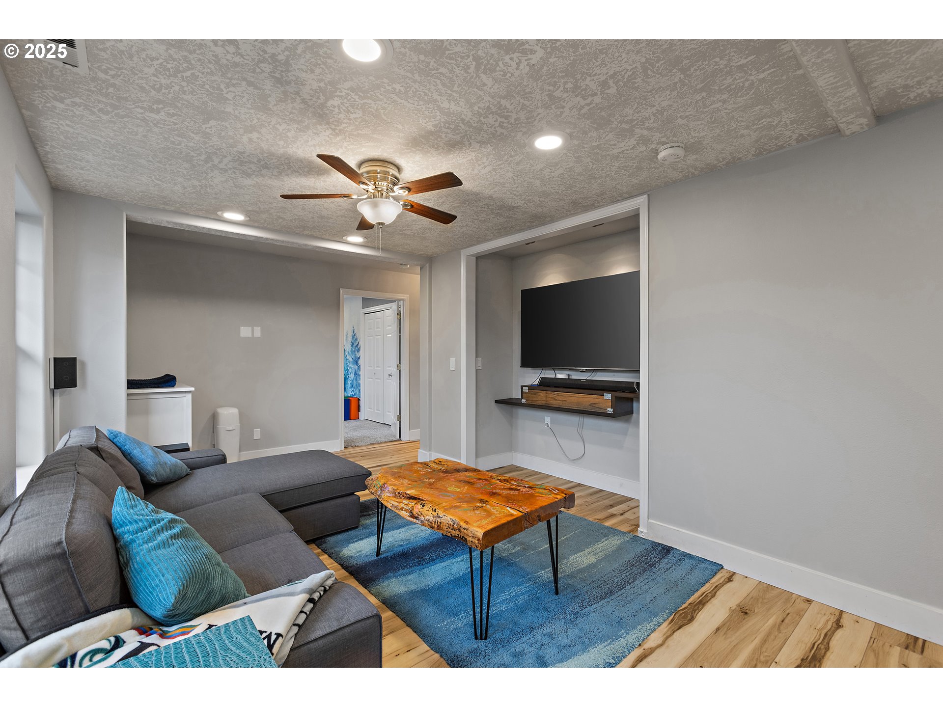 7771 St Charles Street Northeast Keizer, OR 97303 - Photo 31 of 42 a living room with furniture and a flat screen tv