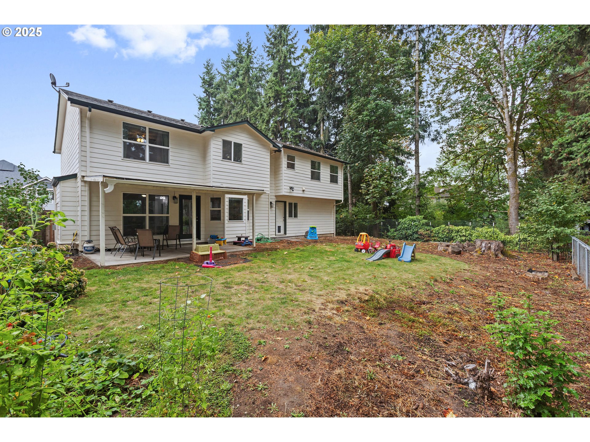 7771 St Charles Street Northeast Keizer, OR 97303 - Photo 39 of 42 a view of a house with a yard and sitting area