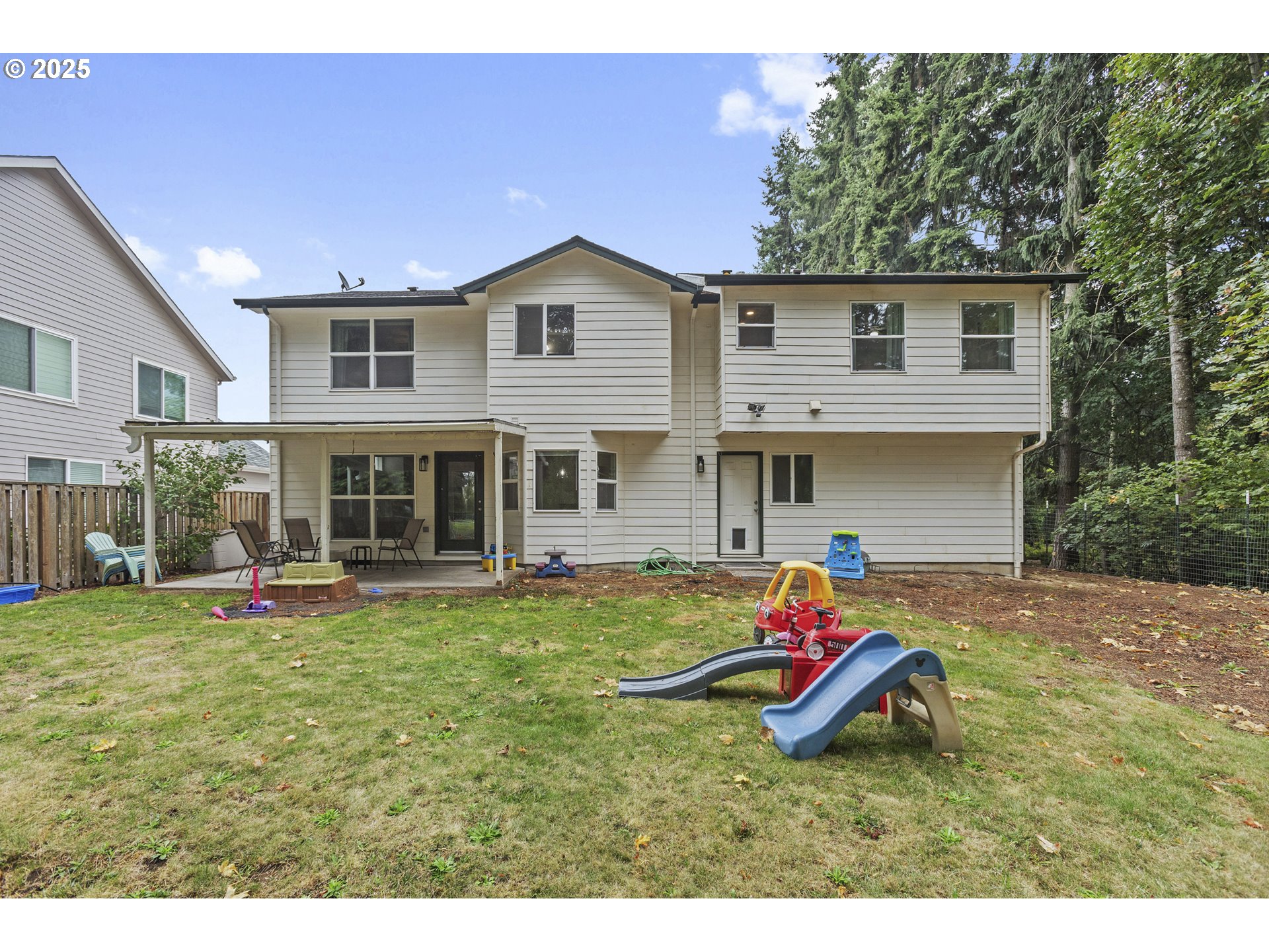 7771 St Charles Street Northeast Keizer, OR 97303 - Photo 40 of 42 a backyard of a house with table and chairs