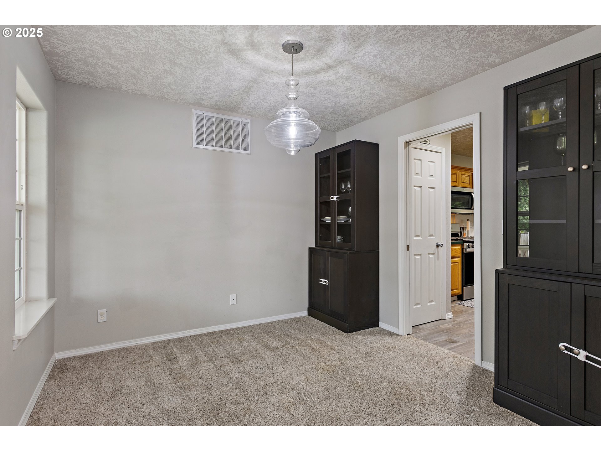 7771 St Charles Street Northeast Keizer, OR 97303 - Photo 8 of 42 view of an empty room with closet and windows